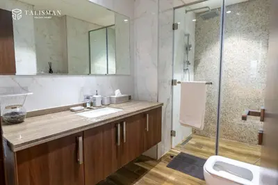 a bathroom with a sink and a shower at Elegant 1 BR Apartment in J One Tower in Dubai