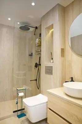 a bathroom with a sink and a toilet and a shower at Vista Downtown Poolside 1BR Walk to Burj Khalifa in Dubai