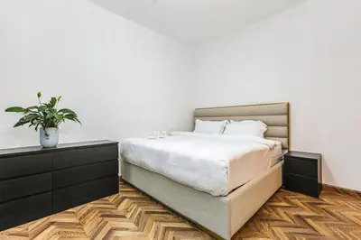 a bedroom with a bed and a potted plant at FIRST CLASS VILLA Tranquility Meets Luxury in Dubai