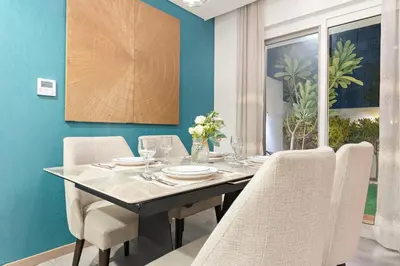 a dining room with a table and chairs at FIRST CLASS VILLA Spacious for Family Getaways in Dubai