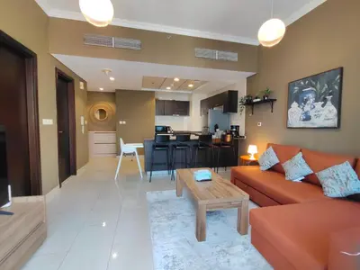 a living room with a couch and a table at Bay View in Marina Bay in Dubai