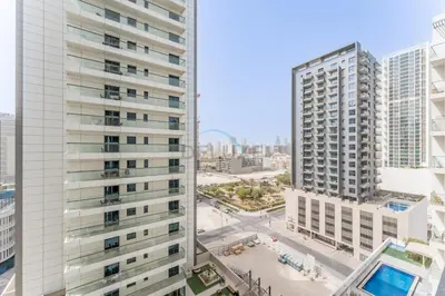 an aerial view of two tall buildings in a city at Studio with Community Views, Easy Access to Bus Stop, Parks, and Circle Mall, Empire Residence, JVC by Deluxe Holiday Homes in Dubai
