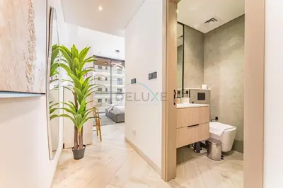 a bathroom with a sink and a toilet at Studio with Community Views, Easy Access to Bus Stop, Parks, and Circle Mall, Empire Residence, JVC by Deluxe Holiday Homes in Dubai