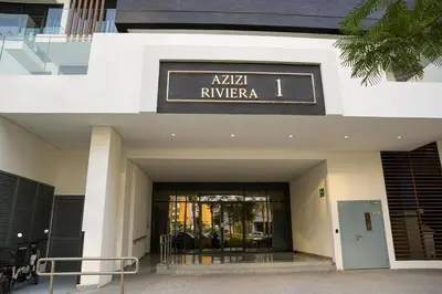 a building with a sign that reads akala riviera at New Studio in Meydan With Pool & Gym in Dubai