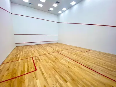 a room with a basketball court with a wooden floor at Luxury 1BR Apartment Dubai in Dubai
