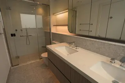 a bathroom with a sink and a shower and a toilet at Spacious 3BR in Sobha Hartland near Downtown in Dubai