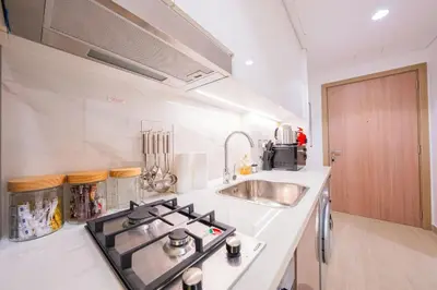 a kitchen with a stove and a sink at Stunning Studio with Swimming Pool View in Dubai