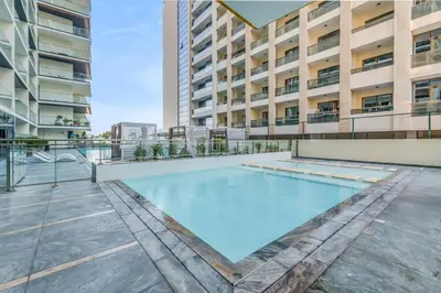 a swimming pool in the middle of a building at 1 Bedroom Dream Stay- Binghatti in Dubai