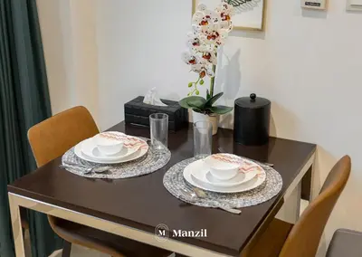 a dining room table with two plates and dishes on it at Luxury Studio close to Dubai Mall and Burj Khalifa in Dubai