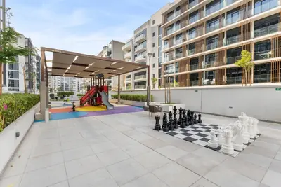 a play area with a chess board and a playground at Stylish City Studio with Burj Khalifa View in Dubai