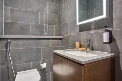 a bathroom with a sink and a toilet at STAY BY LATINEM Luxury 1BR Holiday Home CC 0813 Near Downtown in Dubai