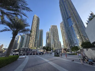 a group of tall buildings in a city at Iconic Burj Khalifa, Fountain Views, Luxury 2BR in Sabkhah