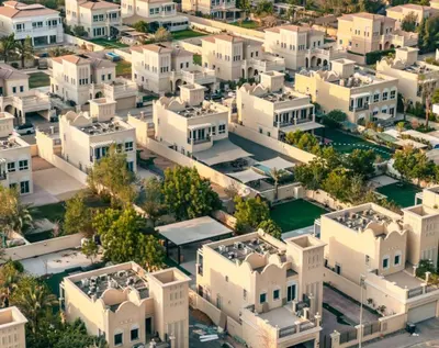an aerial view of a city with white houses at Modern Place - Binghatti Azure 1244 in Dubai