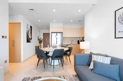 a living room and kitchen with a table and a couch at Burj Royale Luxury Burj Khalifa dubai mall downtown city centre in Dubai