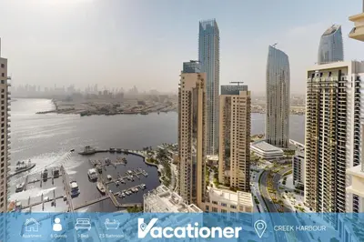 a view of a city with tall buildings and a river at Harbour Views - Chic Three Bed with Creek Views in Dubai