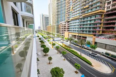 an aerial view of a city street with tall buildings at Beach Serenity, Modern 1BR in Dubai, Palace Beach Residences, Emaar Beachfront in Dubai