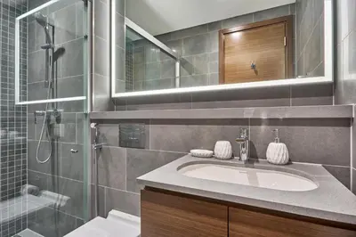 a bathroom with a sink and a shower at STAY BY LATINEM Luxury 1BR and Study Holiday Home CC 2808 Near Downtown in Dubai