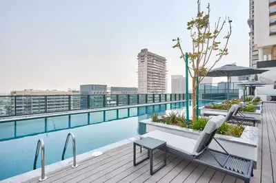 a pool on the roof of a building at STAY BY LATINEM Luxury 1BR and Study Holiday Home CC 2808 Near Downtown in Dubai