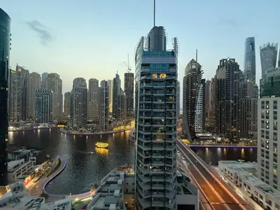 a view of a city with a river and buildings at Marina Bliss-Live where Luxury Meets the Sea in Dubai