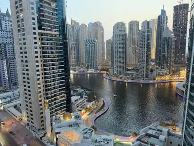 a view of a city with a river and buildings at Marina Bliss-Live where Luxury Meets the Sea in Dubai