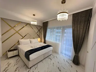 a bedroom with a bed and a large window at Marina Bliss-Live where Luxury Meets the Sea in Dubai