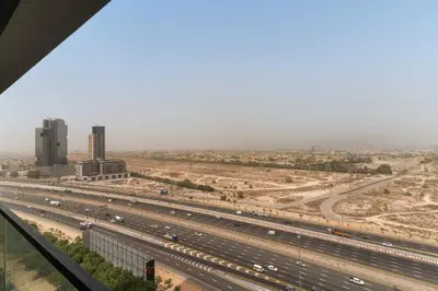 an aerial view of a highway with cars at VayK - Brand New and Bright 1BR in JVC in Dubai