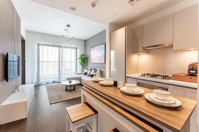 a kitchen with a counter with plates on it at HAVN - 2 Bedroom at The Crest, Dubai Skyline Views in Dubai
