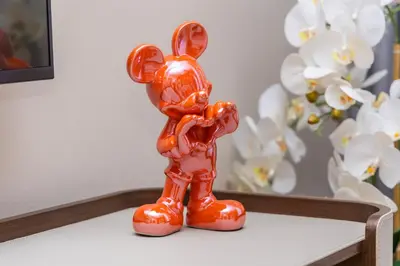 an orange statue of a bunny standing on a table at NEU Sea and Burj View Port de La Mer in Dubai