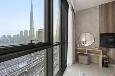 a bathroom with a large window with a view of a city at 2BR Apt Direct Dubai Mall Access Burj View in Dubai