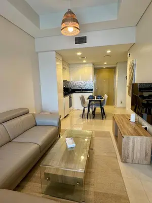a living room with a couch and a coffee table at Samani vacation homes 2217 in Dubai