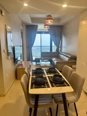 a kitchen and living room with a table and chairs at Samani vacation homes 2217 in Dubai