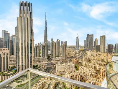 an aerial view of a city with tall buildings at Downtown Charm Burj View 1BR in Dubai