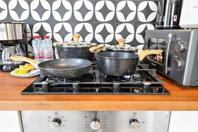 two pots sitting on top of a stove in a kitchen at Dubai Hills 2BR Collective Tower in Dubai