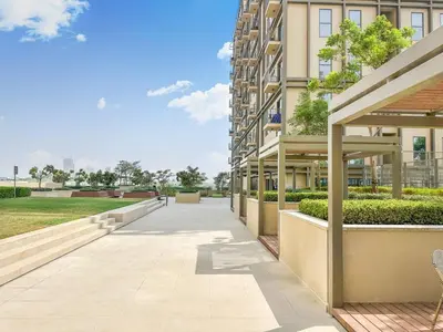 a walkway in front of a building at Dubai Hills 2BR Collective Tower in Dubai