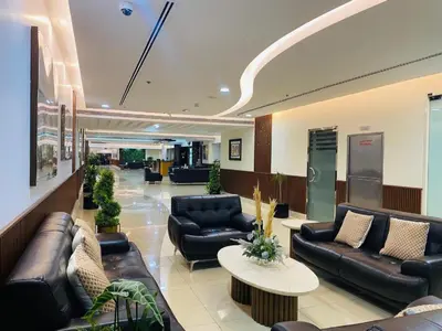 a lobby with couches and tables in a hospital at Marine View Tower aparthotel in Dubai