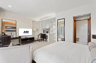 a hotel room with a bed and a kitchen at Abi Holiday Homes - Studio & 1BR Dubai Mall Fashion Avenue Residences in Dubai
