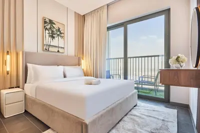 a bedroom with a bed and a large window at STAY BY LATINEM Luxury 1BR Holiday Home CB 2701 Near Burj Khalifa in Dubai
