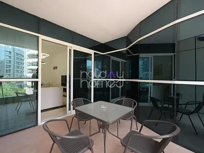 a dining room with a table and chairs at Spacious 3BR in Zen Tower Dubai Marina in Dubai