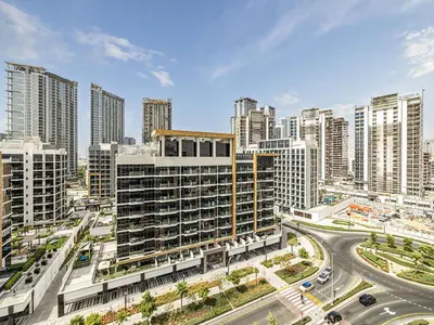 an aerial view of a city with tall buildings at Livin' Holidays - Studio - Azizi Near Downtown in Dubai