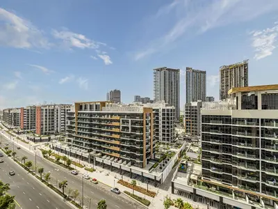 a view of a city with tall buildings and a street at Livin' Holidays - Studio - Azizi Near Downtown in Dubai