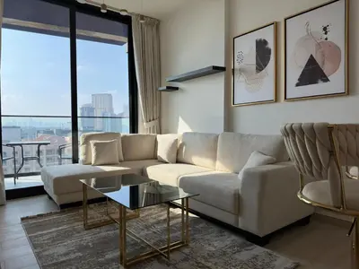 a living room with a couch and a table at Stylish One Bedroom Apartment at Binghatti Crest, JVC Dubai By al sarya Holiday Homes in Dubai