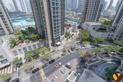 an aerial view of a street in a city with tall buildings at Vogue Downtown Boulevard Central near Burj Khalifa and Dubai Mall, Two Bedroom Apartment with Balcony and Burj Khalifa View, Access to all Amenities in Dubai