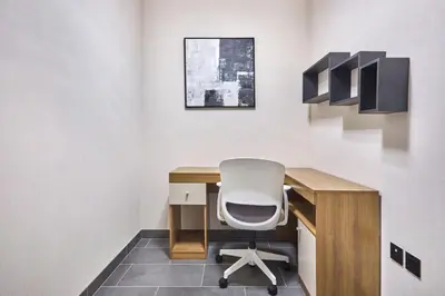 an office with a desk and a white chair at STAY BY LATINEM Luxury 2BR Plus Study Holiday Home CB 3312 Near Burj Khalifa in Dubai