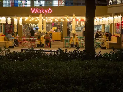 a view of a restaurant at night at Cosmos Living Majestic Studio GCV2 in Dubai