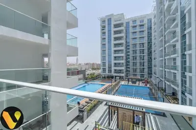 a view of a swimming pool in a building at Vogue Al Furjan Pearlz by Danube near Ibn Battuta Mall, One Bedroom Apartment with Balcony and Pool View, Access to all Amenities, Walkable to Al Furjan Metro Station in Dubai