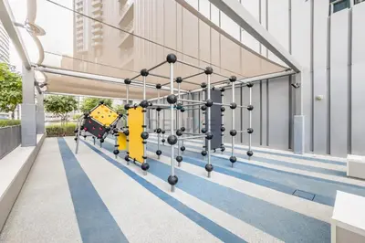 an empty playground in a building with a swing at Luxury 1BR Stay, Connected to Dubai Mall and Burj Khalifa, Vida Dubai Mall Tower 2, Downtown Dubai by Deluxe Holiday Homes in Dubai