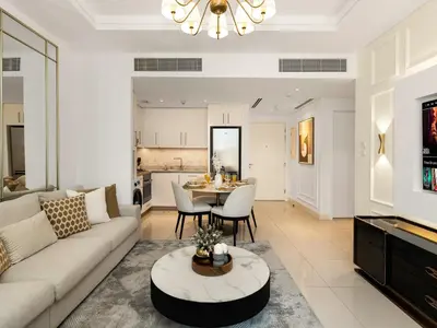 a living room with a couch and a table at Kensington Perfect 1BR Burj View and Dubai Mall Link in Dubai