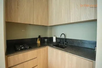 a kitchen with a sink and a counter top at The Autograph-Art Meets Comfort in Dubai