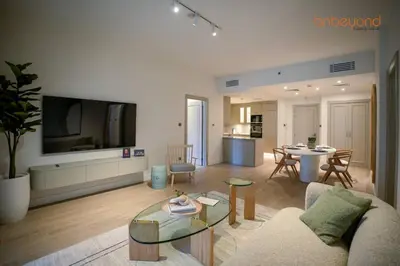 a living room with a couch and a table at Bnbeyond Ultra-Luxe 2BR with Burj Khalifa Panorama in Dubai