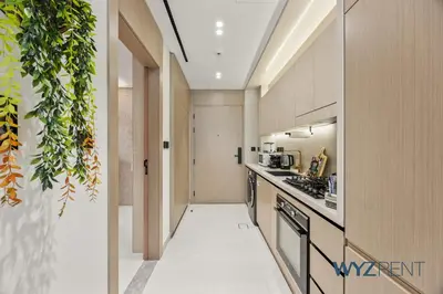 a kitchen with a stove and a counter top at Boho Grecian Studio in JVC Pool & Gym Access in Dubai